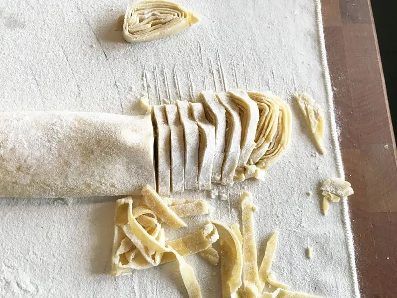 Cut the jelly-rolled dough into 1/4 inch slices
