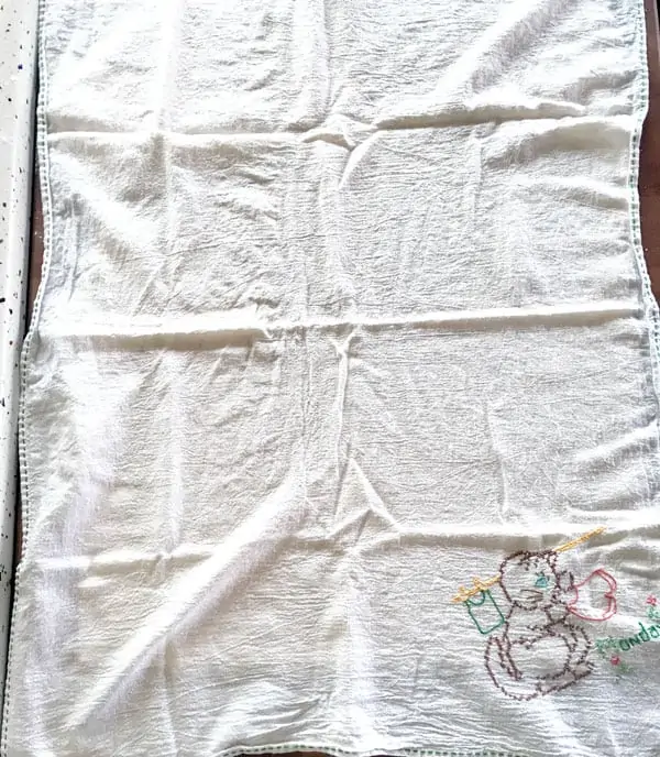 Homemade beef and noodles are almost done - the noodle dough is resting under a hand embroidered tea towel.