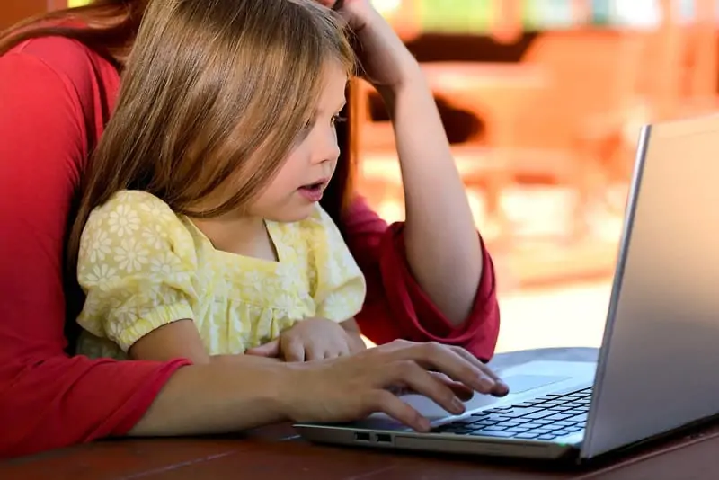 Photo by alphalight1--890049
Mother with child on lap working on a laptop. Caucasian