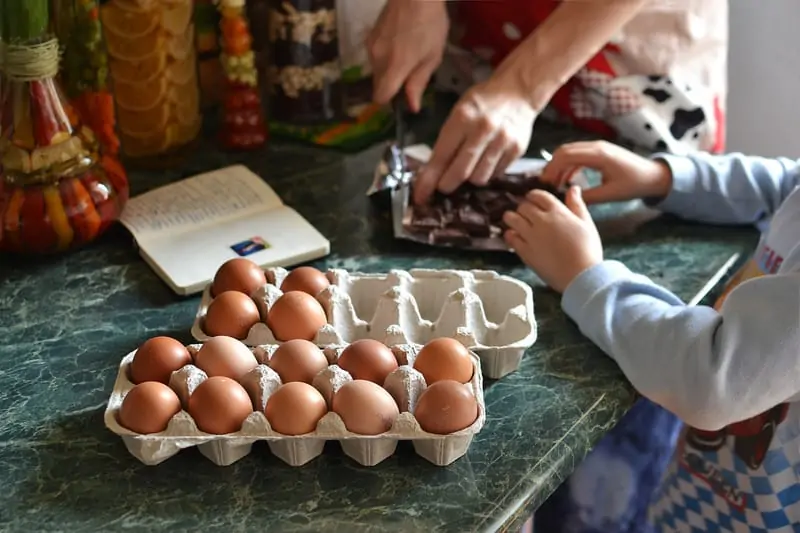 Photo by severyanka--246764. Parent and child cooking together. Caucasian.
