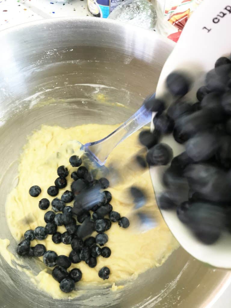 Folding blueberries into batter