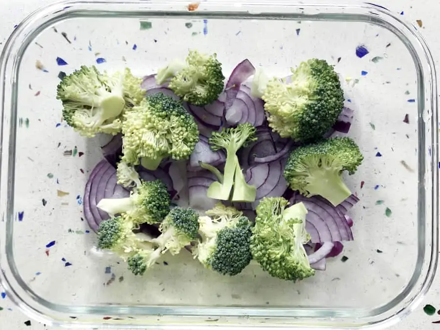 Broccoli and onion in glass dish