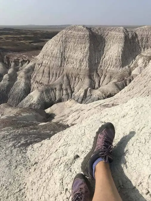 Hiking boots on Blue Mesa trail Petrified Forest NP