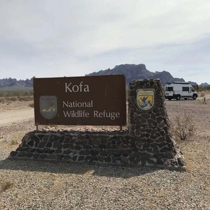 Kofa National Wildlife refuge with Ram Promaster van in background. Free camping in Arizona. A great place for women camping alone.
