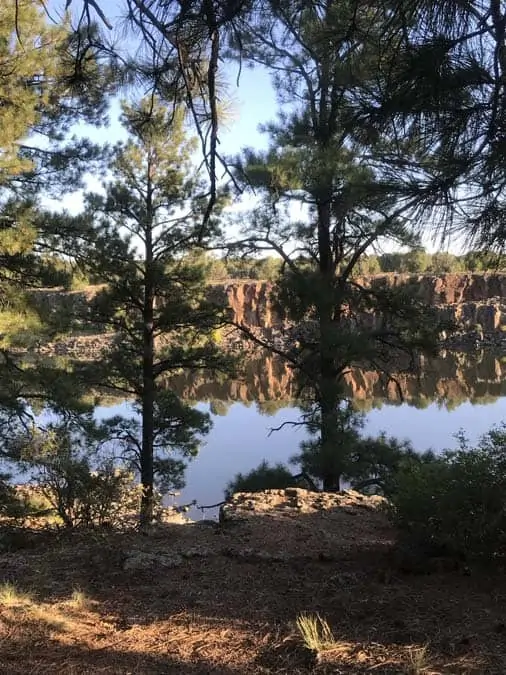 Women camping alone in Fool Hollow Campground.  Show Low, AZ.  View from campsite.