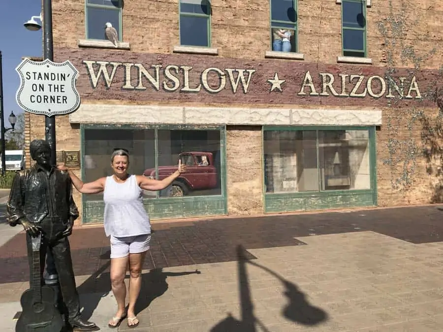 A woman camping alone, Standin' on the corner in Winslow Arizona
