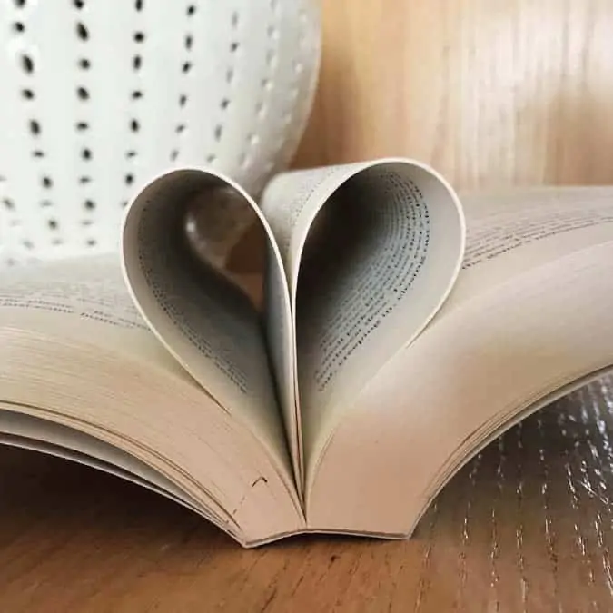 Best Feel Good Books open book with pages folded into heart shape - square image