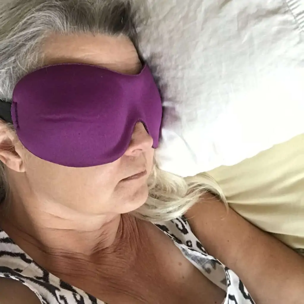 Woman wearing purple eye mask